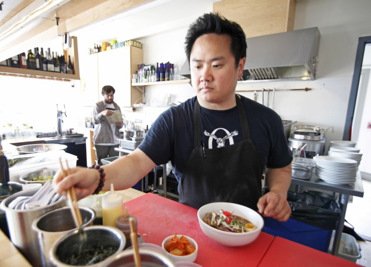 Gary Kim, owner of Anju Noodle Bar in Kittery, creates a portion of shoyu ramen, consisting of meat bone broth, spicy soy tare, slow-roasted pork shoulder, ajitama soy egg and nori.