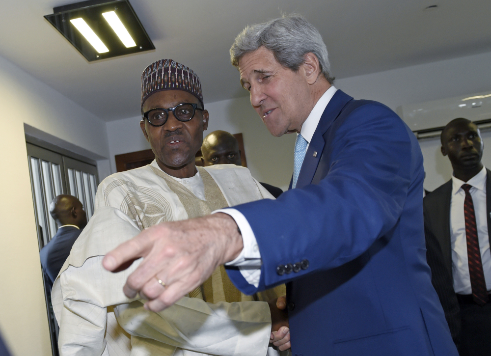 U.S. Secretary of State John Kerry, right, talks with Nigerian President Muhammadu Buhari before a meeting in Abuja, Nigeria, on Friday. The U.S. has indicated it will increase military aid as the country battles the Boko Haram extremists.
The Associated Press
