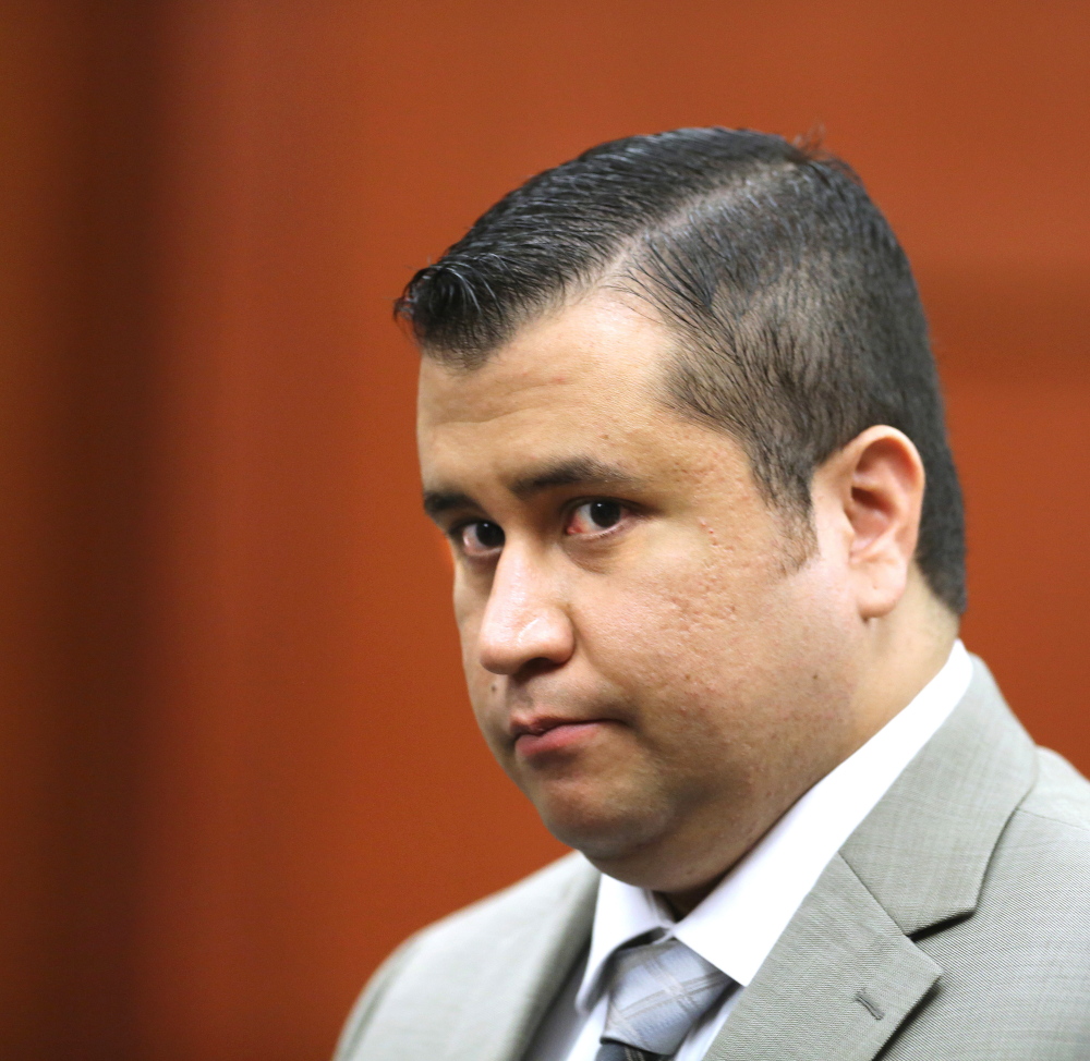 FILE - In this July 9, 2013 file photo, George Zimmerman leaves the courtroom for a lunch break his trial in Seminole Circuit Court, in Sanford, Fla. A police report says a man charged with shooting at George Zimmerman on May 11, 2015, had “a fixation” on the former neighborhood watch leader. The report made public Tuesday, May 19, 2015,  says 36-year-old Matthew Apperson had recently been admitted to a mental institution and had shown signs of paranoia, anxiety and bipolar disorder. (AP Photo/Orlando Sentinel, Joe Burbank, Pool, File via AP)