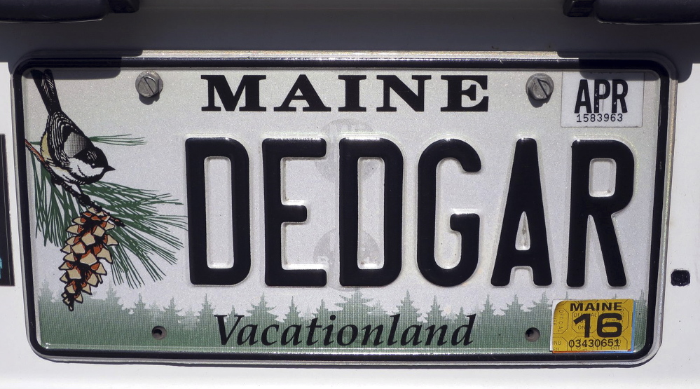 Walter Skold’s license plate for his van, dubbed “Dedgar the Poemobile,” is seen in Freeport.