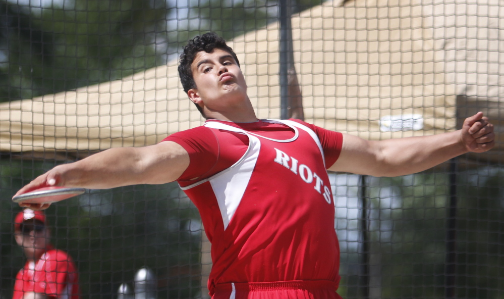 Dan Guiliani, who set a meet record in the shot put, beating the old record by more than 6 feet, also captured the discus with a throw of 163 feet, 6 inches.