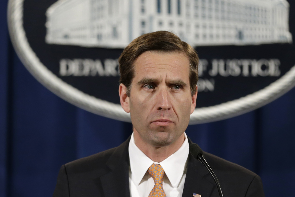 Then-Delaware Attorney General Beau Biden speaks at a news conference at the Justice Department in Washington in 2013.