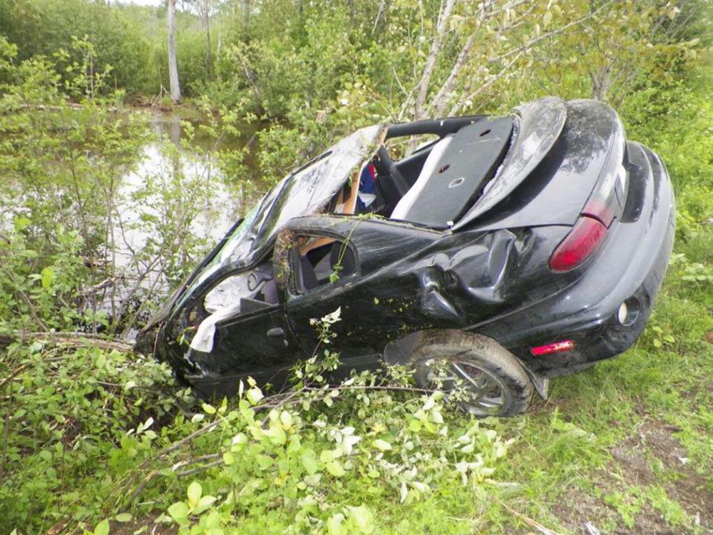 Photo courtesy of Maine State Police
Police say Dustin Smith was fleeing from a crime scene when he crashed this car and was pinned under it. Smith faces several charges including aggravated assault.