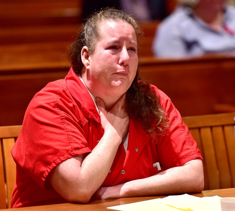 Candice Tucker breaks down as her mother speaks in support of her at Tucker's sentencing Monday for two counts of manslaughter in a crash in October that killed her teenage son and her boyfriend.