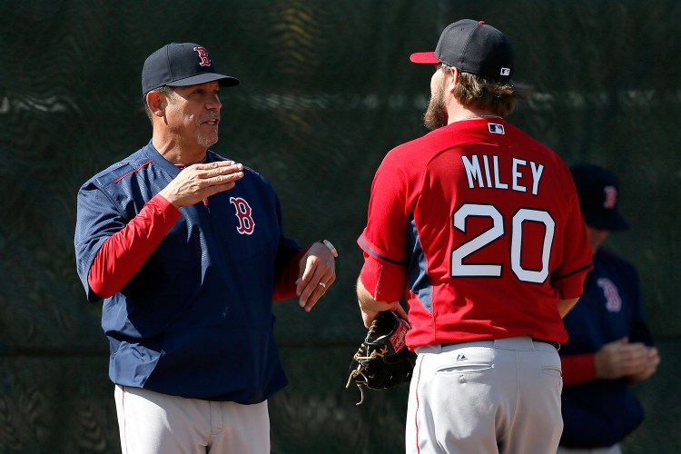 Boston Red Sox pitching coach Juan Nieves, left, was fired Thursday. 