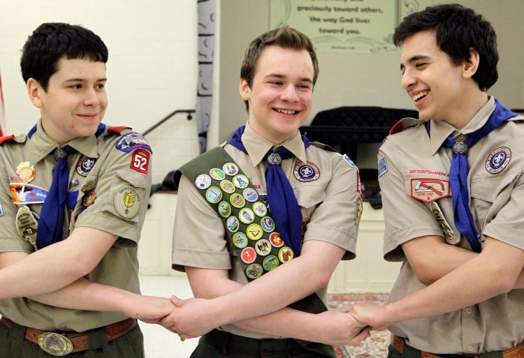 Pascal Tessier, center, takes part in an activity with fellow scouts Matthew Huerta, left, and Michael Fine, right, after he received his Eagle Scout badge in Chevy Chase, Md., in February 2014. Last month, the Boy Scouts' New York chapter announced it hired Tessier, the nation's first openly gay Eagle Scout, as a summer camp leader, in defiance of the national scouting organization's ban on openly gay adult members. 