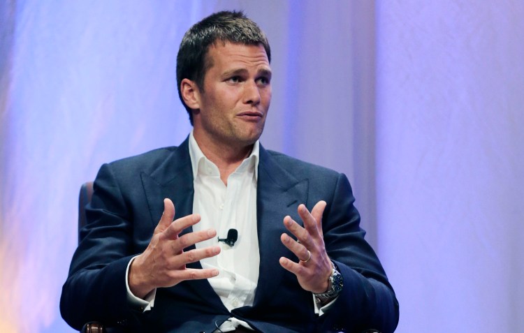 Patriots quarterback Tom Brady speaks during an interview with sportscaster Jim Gray on Thursday night at Salem State University in Massachusetts. Brady gave no direct response to Gray's questions about an NFL investigation's findings that Patriots employees likely deflated footballs and that Brady was "at least generally aware" of the rules violations.