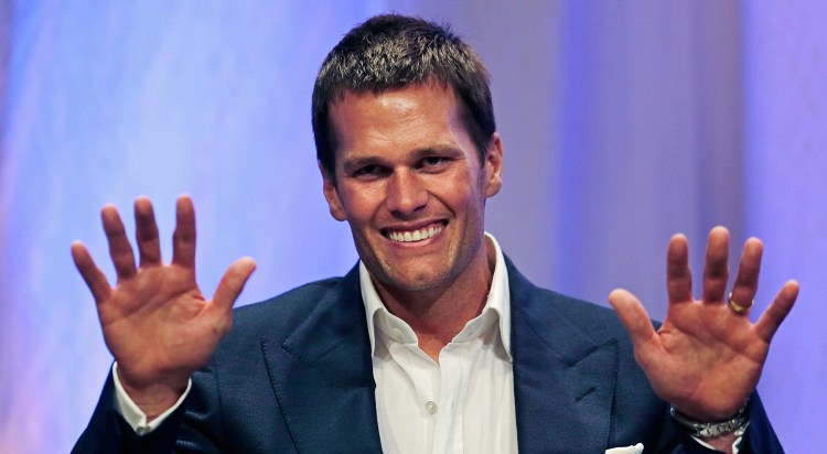 New England Patriots quarterback Tom Brady gestures during an event at Salem State University in Salem, Mass., Thursday, May 7, 2015. The Associated Press