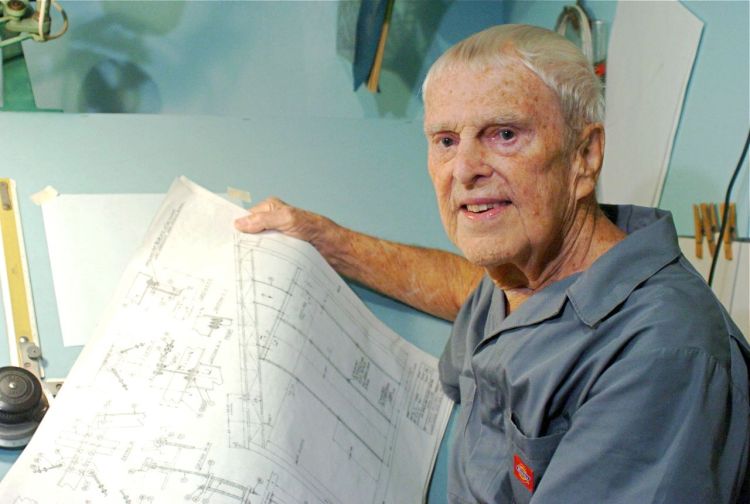 Oscar Carl Holderer, one of Wernher von Braun's original "Operation Paperclip" team members, holds some technical drawings at his home shop in Huntsville, Alabama. Photo by Eric Schultz/AL.com via The Associated Press