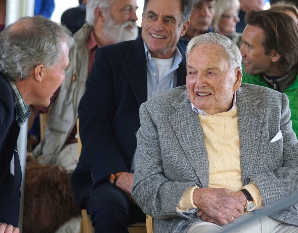 David Rockefeller, right, greets family and friends at a ceremony Friday in Mount Desert marking his gift of 1,000 acres of woodlands, streams, hiking trails and carriage roads abutting Acadia National Park.