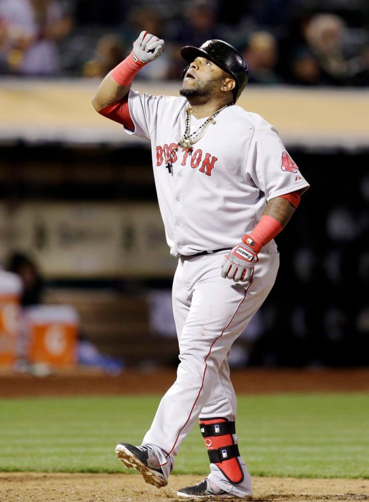 Boston Red Sox Pablo Sandoval celebrates after hitting a home run off Oakland Athletics' Angel Castro in the eleventh inning of Monday's game in Oakland, Calif. The Associated Press