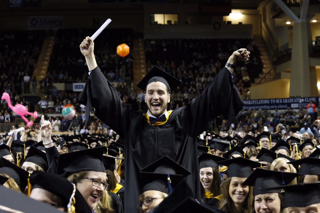 Student celebrates graduation at the University of New England. Photo courtesy of University of New England