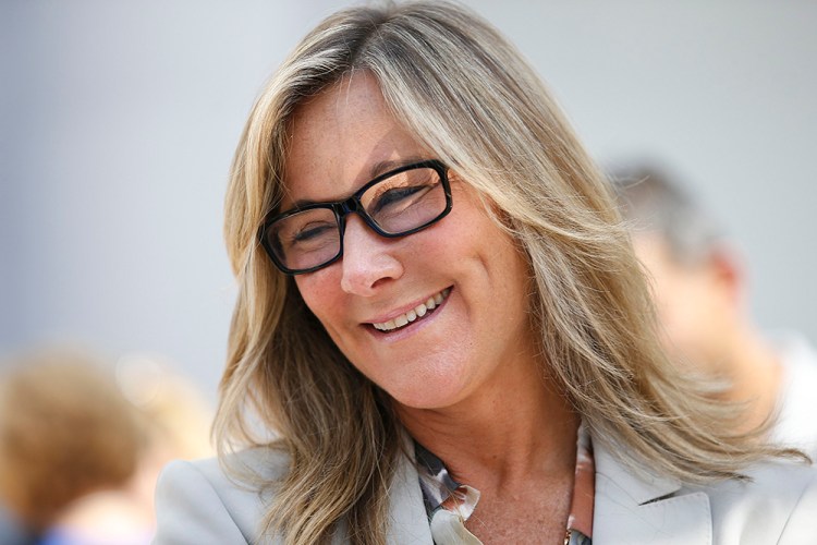 Angela Ahrendts, senior vice president of retail and online stores at Apple Inc., appears at a publicity event in Palo Alto, California, for the  launch of the new iPhone 6 in this Sept 19, 2014, photo.
