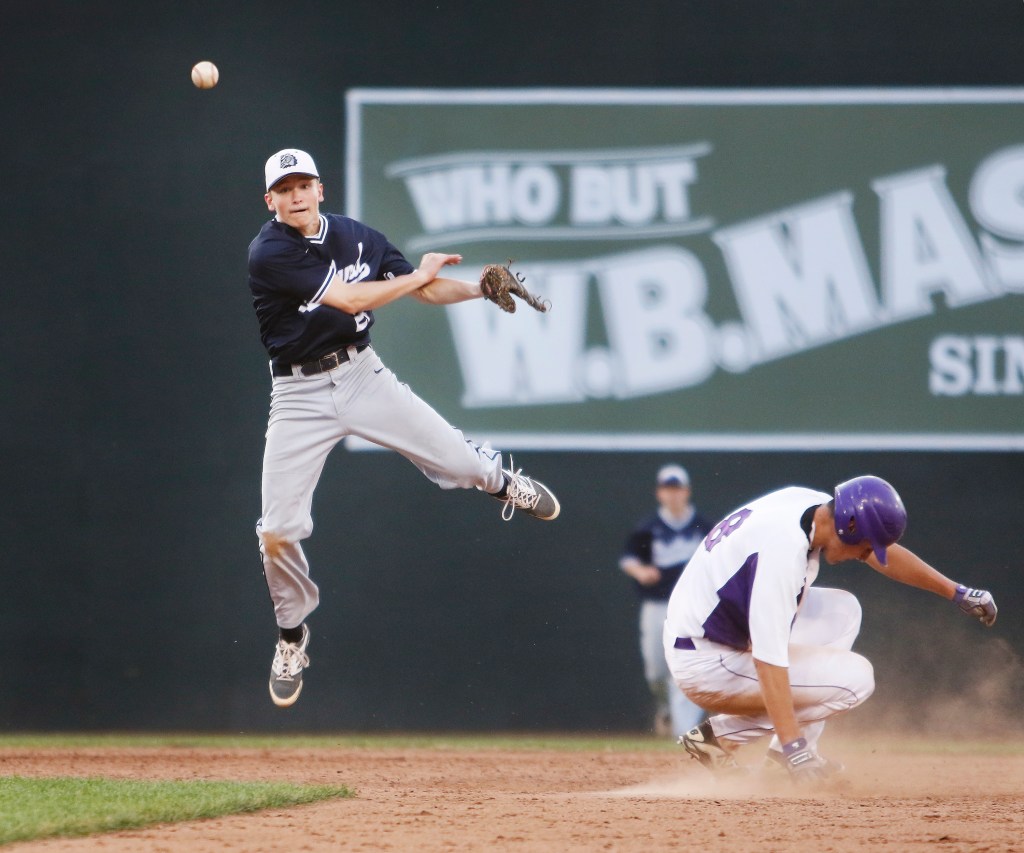 Portland shortstop Jake Knop throws to first after tagging out Dom Bernard of Deering at second base during the fifth inning of Portland’s 4-3 come-from-behind victory in a Western Class A quarterfinal at Hadlock Field. Jill Brady/Staff Photographer