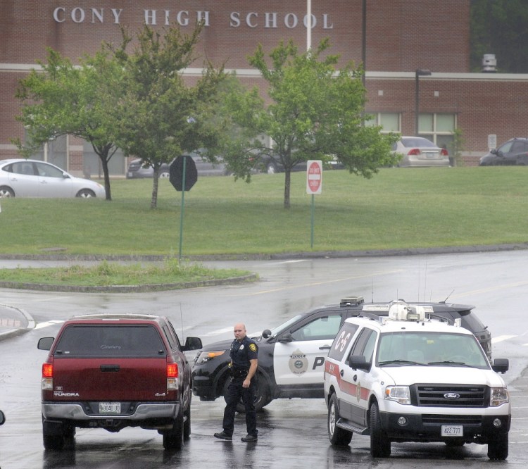 Augusta police and firefighters block the exterior of Cony High School in Augusta on Tuesday after an evacuation of faculty, students and staff because of a perceived threat.