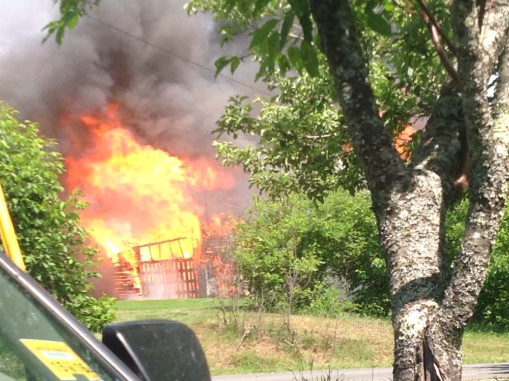 A Saturday fire at a Newport barn was believed to have been started by a smoke bomb for pest control, fire officials said.