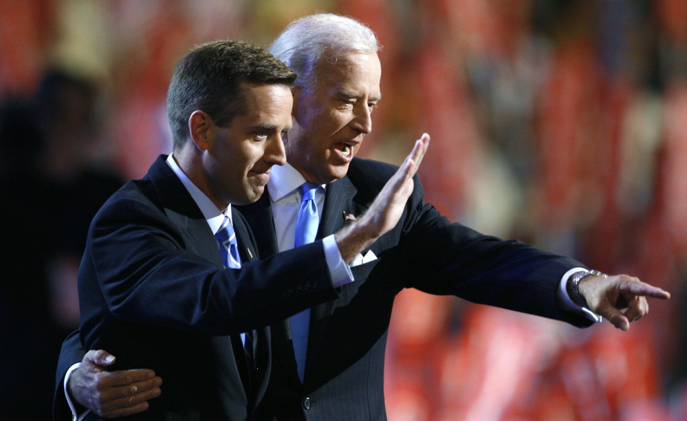 Delaware Attorney General Beau Biden, left, and vice presidential candidate Sen. Joe Biden share the stage at the 2008 Democratic National Convention in Denver, Colo. Beau Biden died of brain cancer Saturday at age 46.