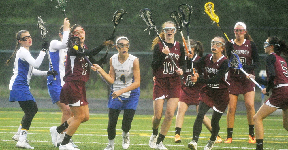 Falmouth’s Olivia Stucker, 4, breaks away from a pack of players during the Yachtsmen’s 15-6 win over Freeport on Monday in Falmouth.