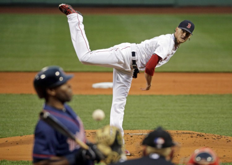 The Twins’ Torii Hunter leans back from an inside pitch by Red Sox starter Clay Buchholz in the first inning Tuesday night at Fenway Park. Buchholz got his first win in more than three weeks, giving up just three hits in eight innings.