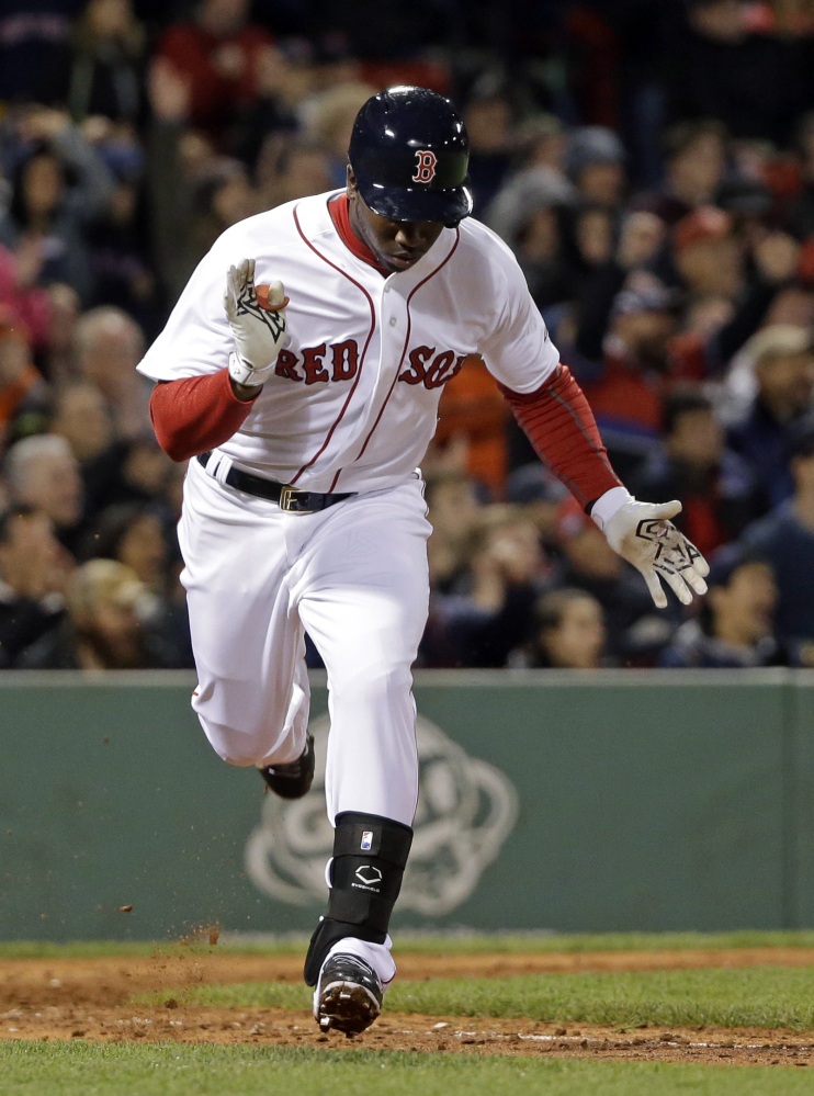 Boston’s Rusney Castillo claps as he runs to first base after driving in the only run of Tuesday night’s game with a single in the seventh inning.