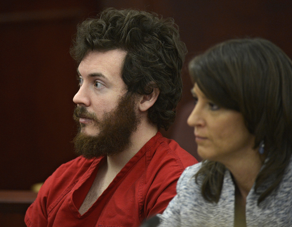 James Holmes and his defense attorney appear in court in March. Prosecutors are building a case that he knew right from wrong when he carried out the deadly Colorado theater shooting, hoping to convince
jurors that he should be convicted and not sent to a psychiatric  hospital.