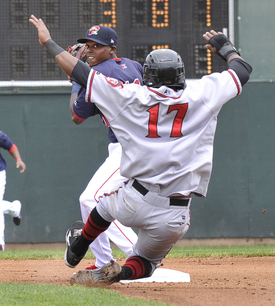 Portland’s Reed Gragnani tries for a double play after getting Richmond baserunner Rando Moreno out at second as the Portland Sea Dogs host the Richmond Flying Squirrels at Hadlock Field in Portland on Thursday morning. Richmond won, 4-3.
