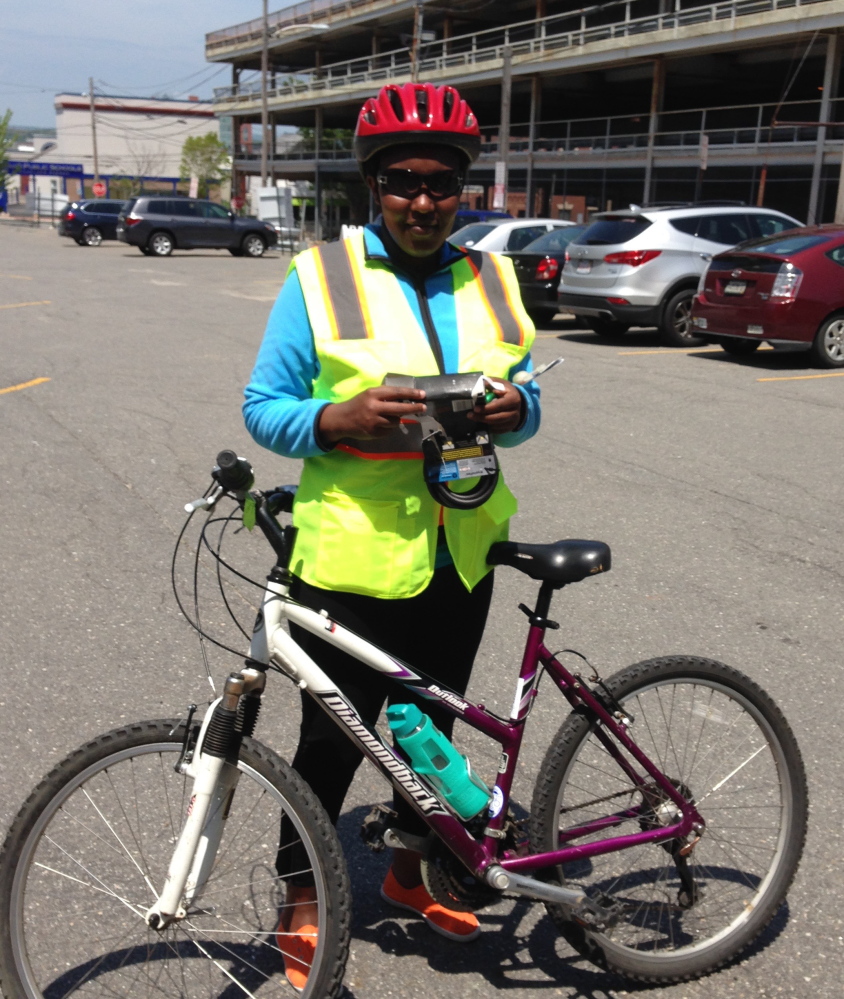 Eugenie Mydear participates in Bikes for New Mainers, which provides immigrants with bike-riding and safety lessons as well as a used bike – the only means of transportation some have.