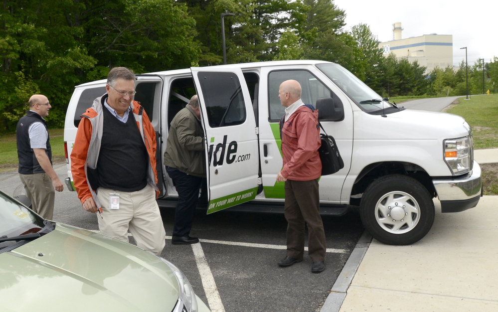 An Idexx commuter van drops its passengers in Westbrook. It’s one of several Maine businesses that give incentives for carpooling.