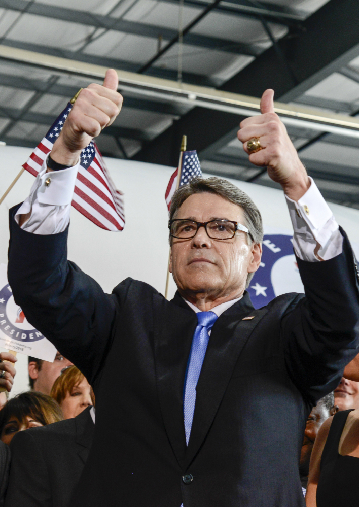 Former Texas Gov. Rick Perry gives a thumbs-up to supporters Thursday after launching  his campaign.