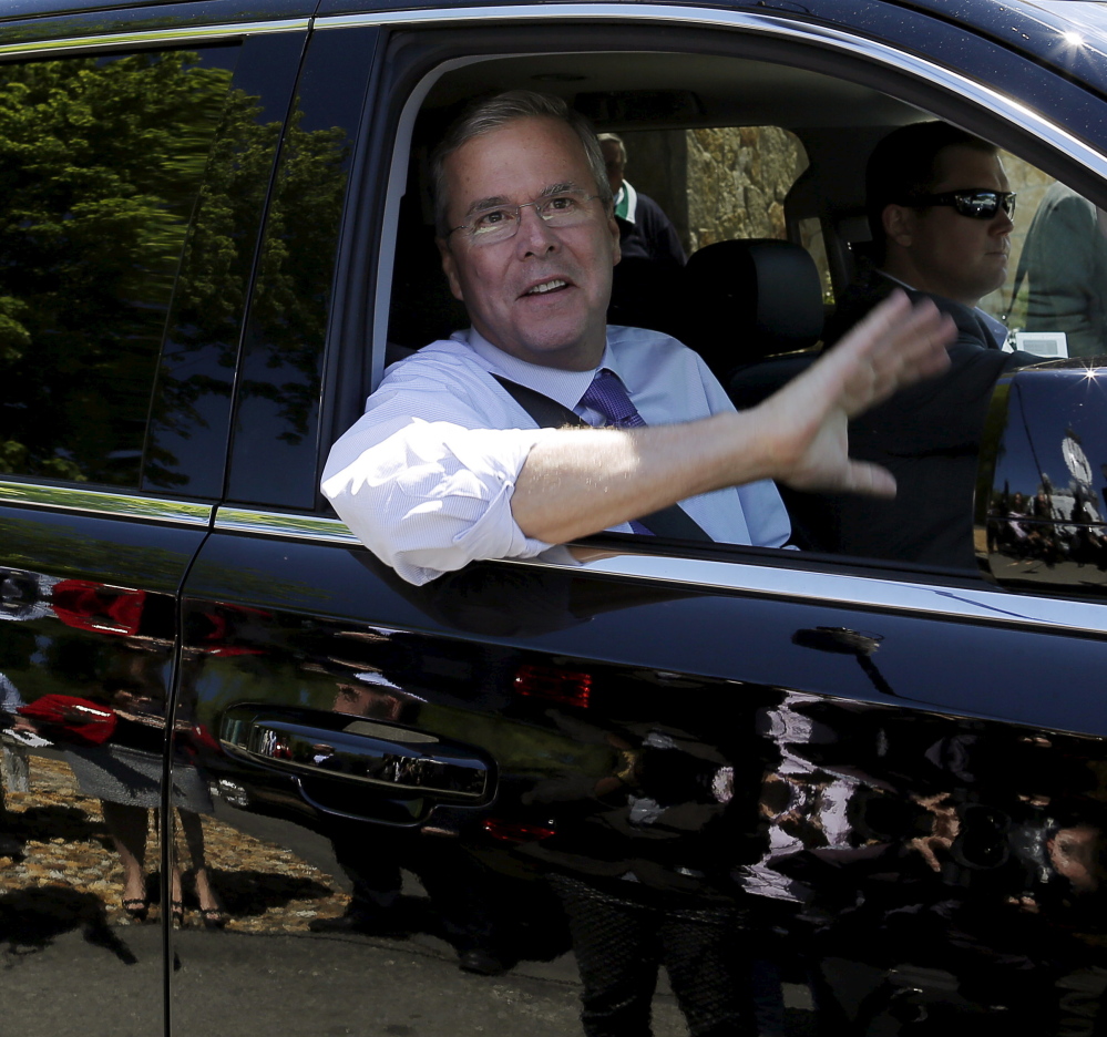 Jeb Bush waves as he leaves a speaking engagement in May. He became instant front-runner Thursday among Republicans jousting for a 2016 nomination.  Reuters