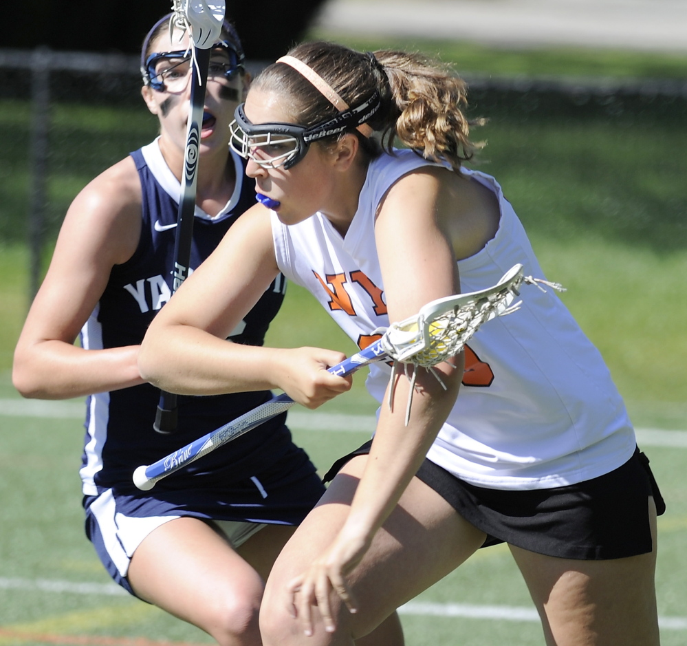 Isabella Munro of North Yarmouth Academy attempts to gain position for a shot while Campbell Dorsett of Yarmouth defends. Yarmouth ended the regular season with an 8-4 record. NYA finished at 1-11.