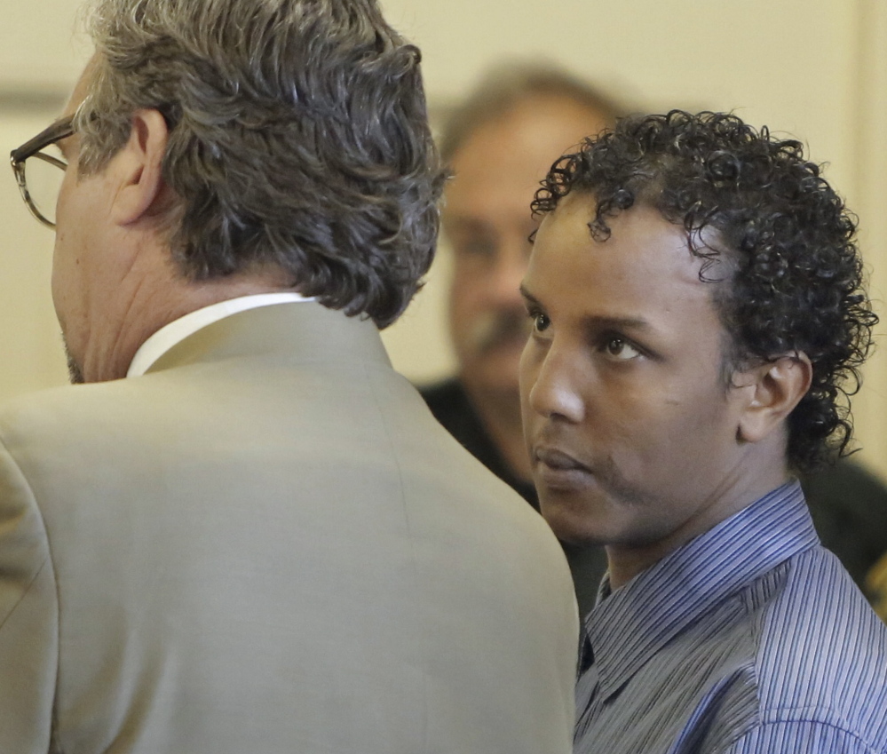Mohamud Mohamed looks to his attorney, Thomas Hallett, during his arraignment Friday in York County Superior Court.