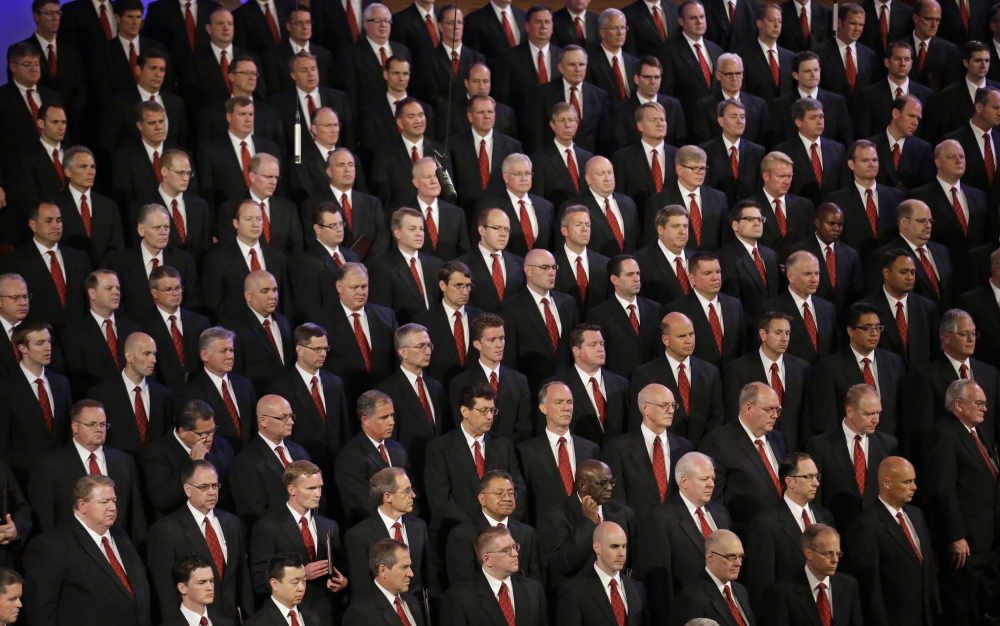 Members of the Mormon Tabernacle Choir look on during the public funeral for L. Tom Perry, a member of The Church of Jesus Christ of Latter-day Saints’ highest governing body, Friday in Salt Lake City, Utah.