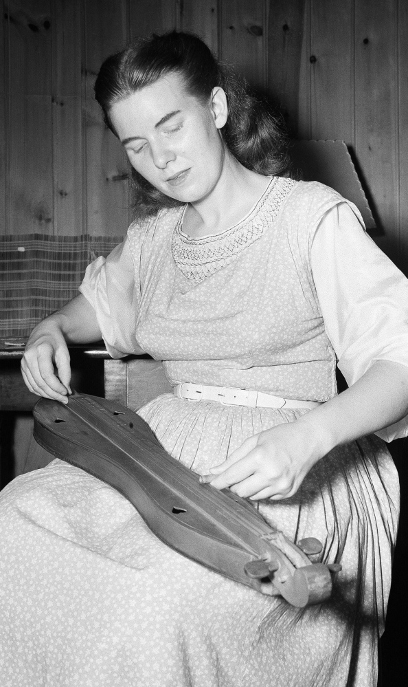 A 1950 photo shows singer Jean Ritchie, who promoted Appalachian folk music and centuries-old ballads.