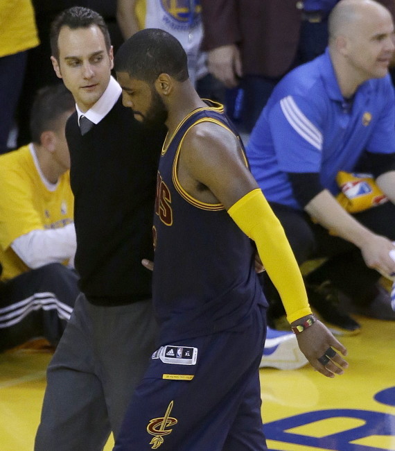 Irving walks off the floor after being injured Thursday in Game 1 of the NBA Finals.