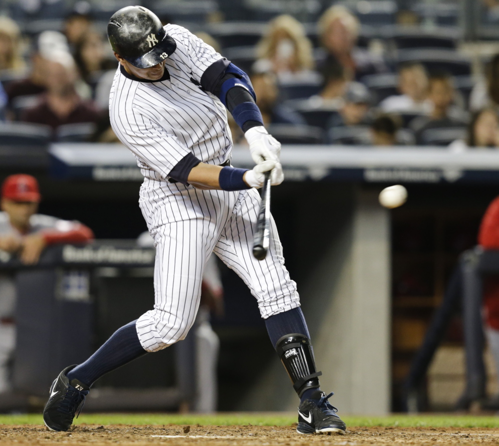 Alex Rodriguez of the Yankees hits an RBI single in the fifth inning against the Angels on Friday night, moving him into second place on the all-time RBI list.