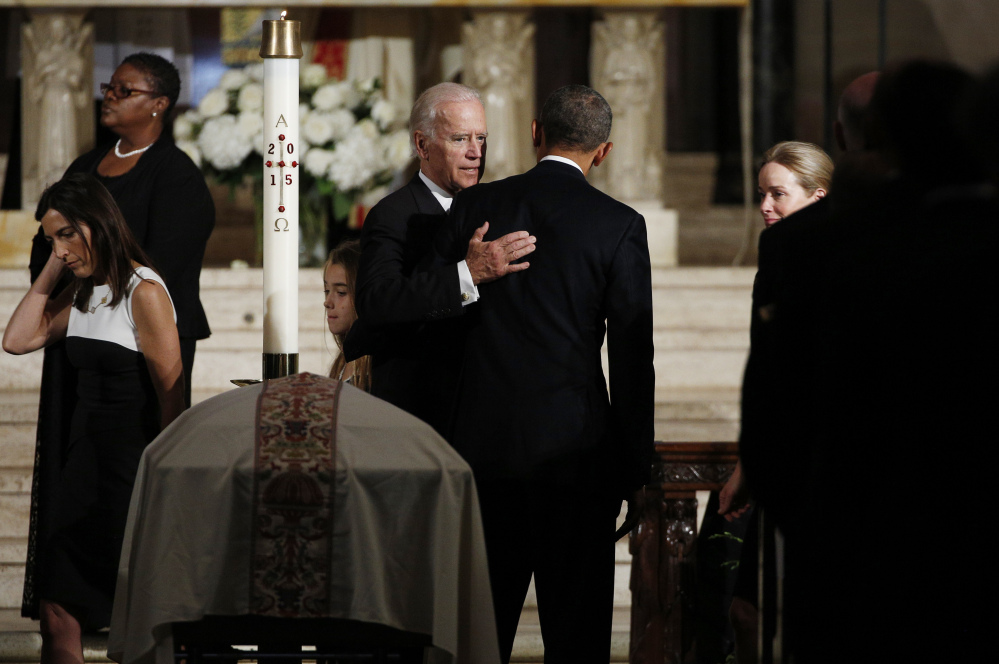 Vice President Joe Biden greets President Obama at a funeral for Biden's son, Beau Biden, on Saturday in Wilmington, Del.
The Associated Press