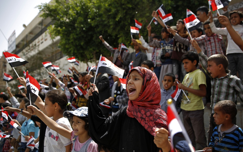 Yemenis chant slogans during a protest against Saudi-led airstrikes, in Sanaa, Yemen, on Saturday,
