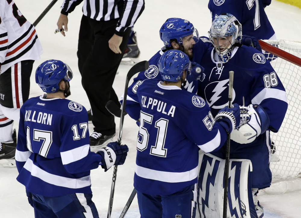 Tampa Bay Lightning players greet backup goalie Andrei Vasilevskiy after their win against the Chicago Blackhawks in Game 2 of the Stanley Cup Finals on Saturday in Tampa, Fla. The Associated Press