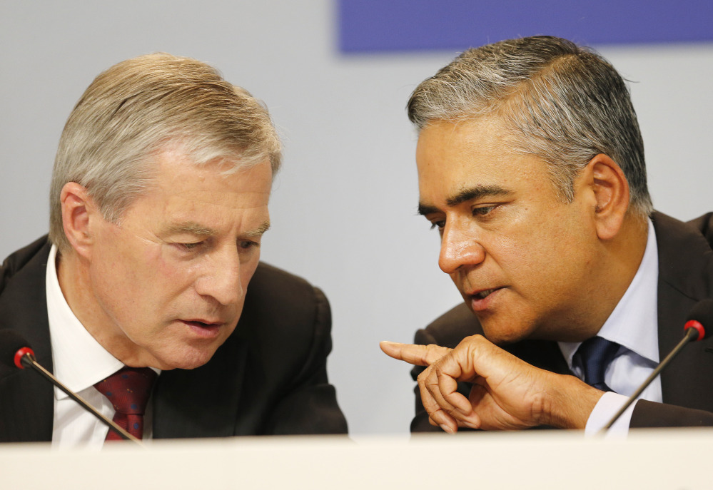 Co-CEOs of Deutsche Bank Anshu Jain, right, and Juergen Fitschen will resign. John Cryan will succeed Jain in July 2015 and will become the sole CEO in May 2016.
