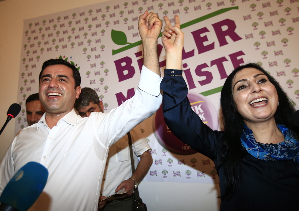 Co-chairs of the pro-Kurdish Peoples’ Democratic Party, called HDP, celebrate their new post-election influence in Turkey’s government after a Sunday press conference in Istanbul.