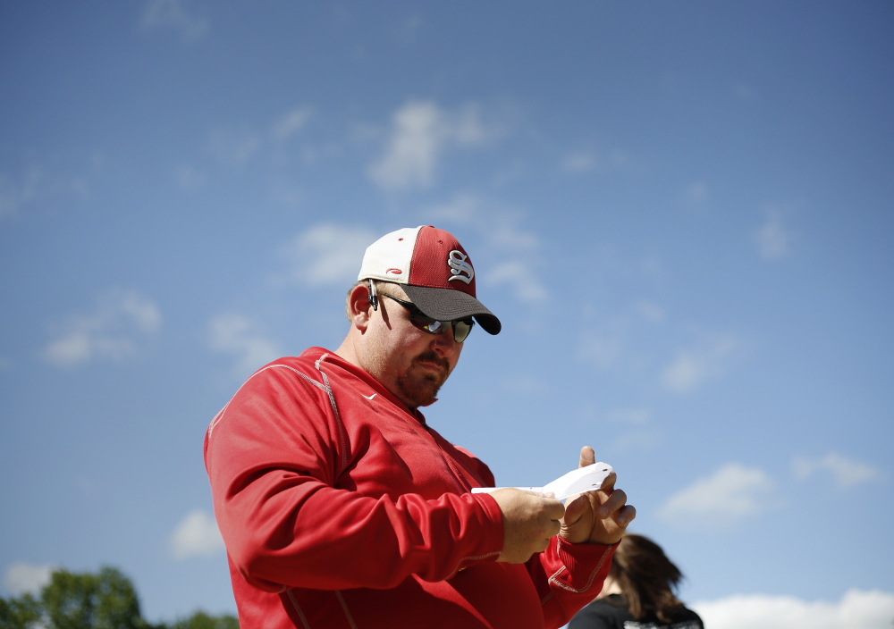 Sanford softball coach Mike Bailey during practice. 
Derek Davis/Staff Photographer