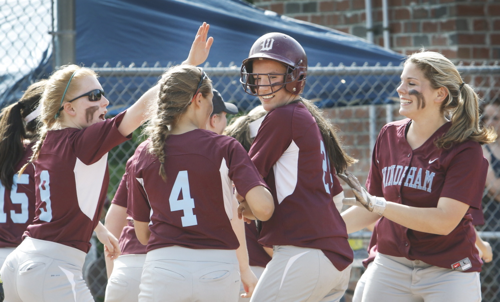 June 9: Windham #24 Sadie Nelson is congratulated by teammates after hitting a home run in the third inning vs. Gorham softball at Windham playoff game Tuesday, June 9, 2015.  Jill Brady/Staff Photographer