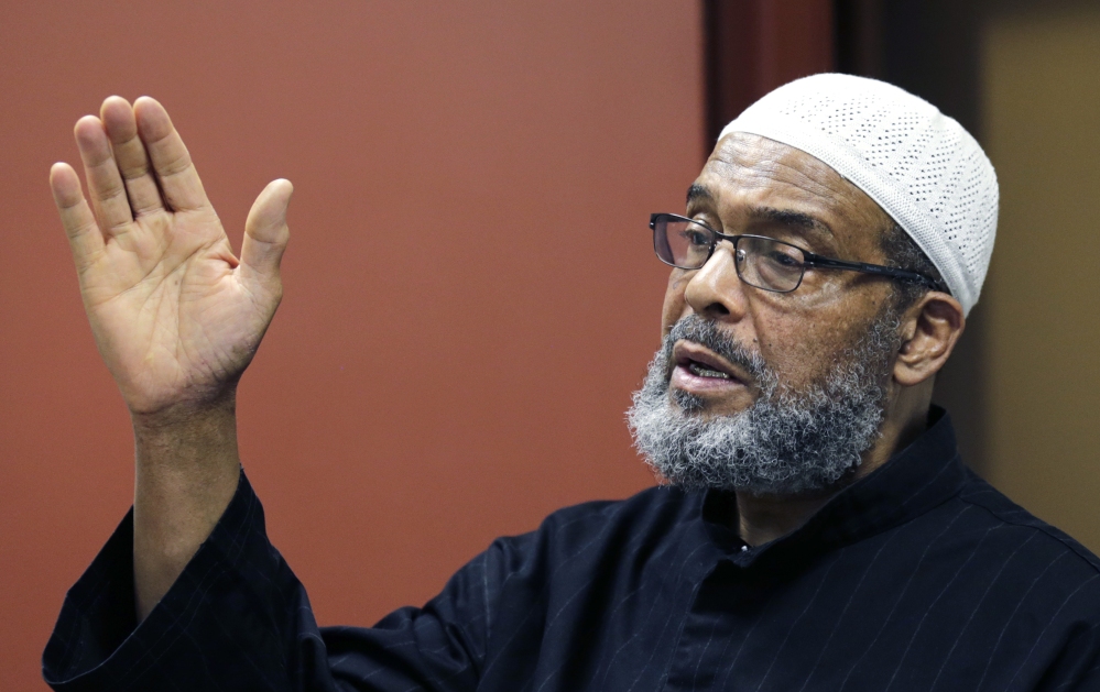 Imam Abdullah Faaruuq answers a question regarding the shooting of Usaama Rahim by law enforcement, during a news conference at the Black Community Information Center in the Roxbury neighborhood of Boston, Tuesday, June 9, 2015. The Muslim leader says video of the man being fatally shot by terror investigators shows authorities were "reckless and "dangerous" in their actions. Faaruuq is a leader of the Mosque for the Praising of Allah in Boston, where Usaama Rahimand his family prayed. (AP Photo/Charles Krupa)
