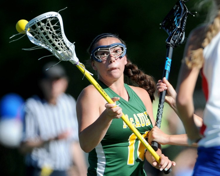 McAuley’s Elizabeth Poulin tries to take control of the ball as Messalonskee defenders close in during the first half of an Eastern Class A quarterfinal game Wednesday at Thomas College in Waterville. Messalonskee won, 14-4.