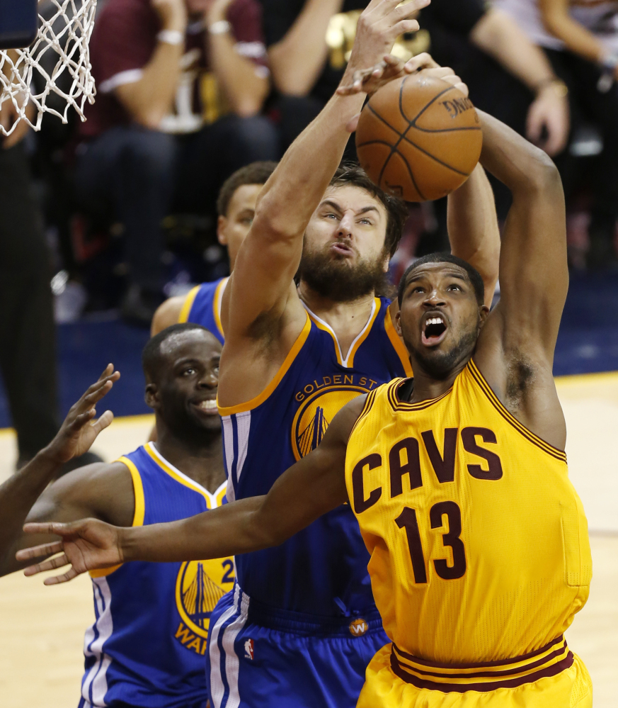 The series is still up for grabs, just like the ball that Golden State Warriors center Andrew Bogut and Cleveland Cavaliers center Tristan Thompson battled for during the second half of Tuesday’s game, won by Cleveland.