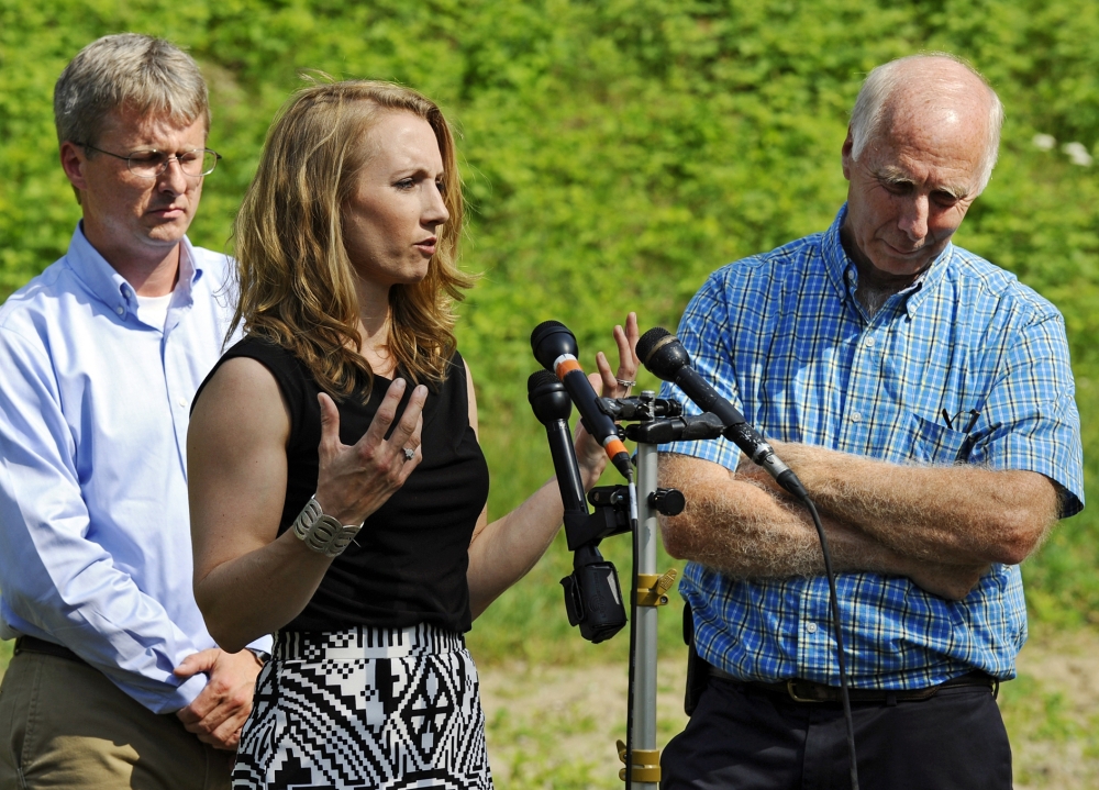 Corinne Maleski speaks about her late brother, Keith Broomfield, flanked by her oldest brother, Andrew Broomfield, 38, left, and father, Thomas Broomfield, in Bolton, Mass., on Thursday. Keith Broomfield died fighting with Kurdish forces against the Islamic State group in Syria.