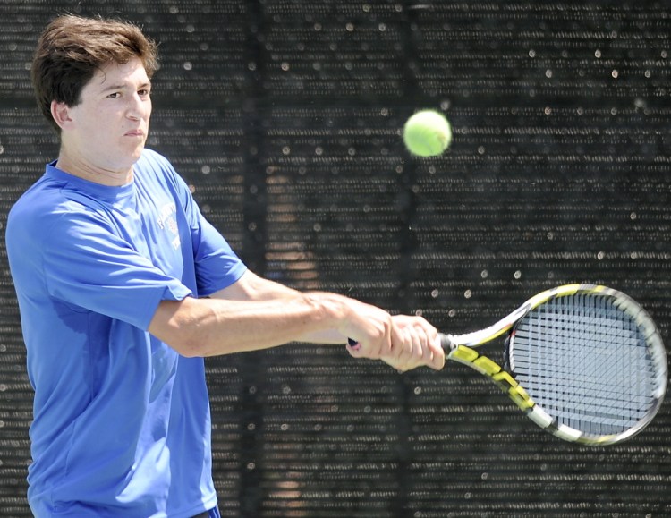Alex Klemperer, the No. 2 singles player for Falmouth as a freshman, returns a volley to Carlos Jimenez of Thornton Academy during Jimenez’s three-set victory Thursday. Klemperer is part of a team that will meet Mt. Ararat on Saturday in an attempt to win a second straight Class A state championship.