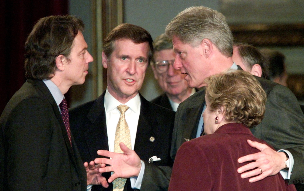 Then-U.S. Secretary of State William Cohen, center, talks with President Clinton, British Prime Minister Tony Blair and U.S. Secretary of State Madeleine Albright before the start of a North Atlantic Council meeting. Cohen draws on his governmental expertise in his novel writing.