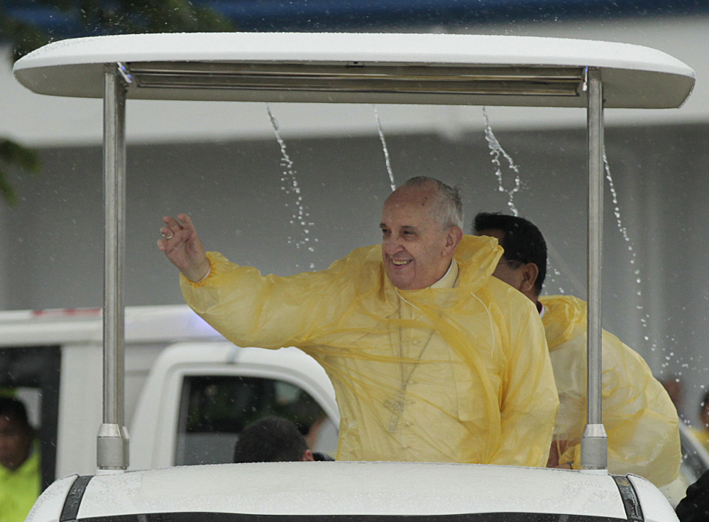 Pope Francis, clad in a raincoat during a visit to the Philippines earlier this year, has caused some concern among global business interests as he confronts the issue of global warming.